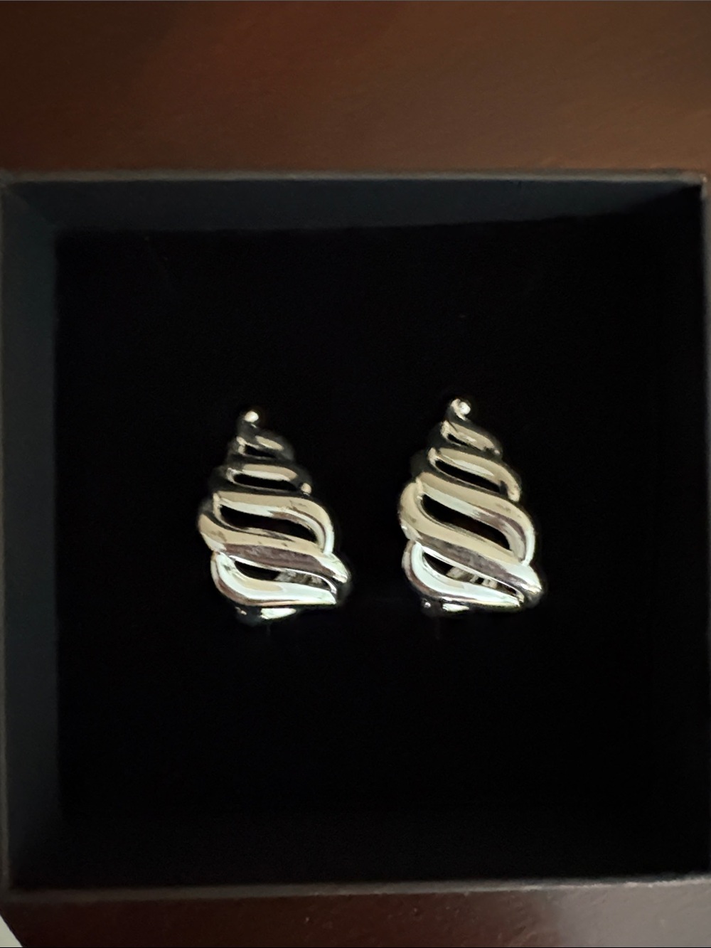 Silver toned earrings.